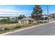 Charming single-story home with a fenced yard and tree in a residential neighborhood at 598 S Navajo St, Denver, CO 80223