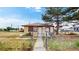 Charming home featuring a well-maintained front yard and inviting entrance at 598 S Navajo St, Denver, CO 80223