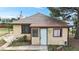Charming single-story home with a chimney, front yard, and muted yellow paint at 598 S Navajo St, Denver, CO 80223