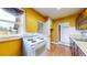 Efficient kitchen with an electric stove and storage spaces for easy meal preparation at 598 S Navajo St, Denver, CO 80223