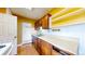 A well-lit kitchen space with abundant countertop and cabinet space, perfect for cooking enthusiasts at 598 S Navajo St, Denver, CO 80223