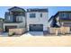 Modern two-story home showcasing a two-car garage and stylish curb appeal at 8509 Orchard City Dr, Littleton, CO 80125