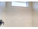 A tiled shower features a window above the shower and a dark shower head at 8509 Orchard City Dr, Littleton, CO 80125