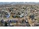 An aerial view of a neighborhood featuring a home with a brown roof at 7288 S Zephyr Way, Littleton, CO 80128