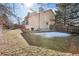 A full view of the back yard featuring grass and a house at 7288 S Zephyr Way, Littleton, CO 80128