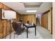 This is a basement office featuring paneled walls, carpet, and a black desk at 7288 S Zephyr Way, Littleton, CO 80128