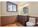 Bathroom features a vanity, a granite countertop, and a hardwood floor at 7288 S Zephyr Way, Littleton, CO 80128