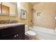 Bathroom features a tub, tiled shower and granite countertop at 7288 S Zephyr Way, Littleton, CO 80128