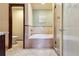 Bathroom features a tiled bathtub, tiled shower and toilet at 7288 S Zephyr Way, Littleton, CO 80128