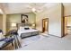 This main bedroom features an accent wall, windows, and a ceiling fan at 7288 S Zephyr Way, Littleton, CO 80128