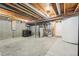 Large, unfinished basement ready for customization with visible mechanicals and ample room to grow at 23505 E Platte Dr # 8D, Aurora, CO 80016