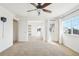 Bright bedroom featuring a ceiling fan, large windows, and plush carpeting at 23505 E Platte Dr # 8D, Aurora, CO 80016