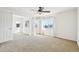 Spacious carpeted bedroom with multiple windows and bright light at 23505 E Platte Dr # 8D, Aurora, CO 80016