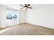 Bright bedroom with a ceiling fan and a large window overlooking a neighborhood at 23505 E Platte Dr # 8D, Aurora, CO 80016