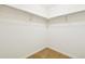 Walk-in closet with neutral carpet and open shelving at 23505 E Platte Dr # 8D, Aurora, CO 80016