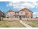 Inviting townhome with a well-manicured lawn and charming architectural details at 23505 E Platte Dr # 8D, Aurora, CO 80016