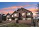 Charming townhome exterior with a warm color palette and well-kept landscaping at 23505 E Platte Dr # 8D, Aurora, CO 80016