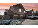 Exterior view of townhome featuring multiple garage doors and a cozy neighborhood setting at 23505 E Platte Dr # 8D, Aurora, CO 80016