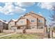 Beautiful townhouse with unique siding, stone accents, and well-maintained landscaping at 23505 E Platte Dr # 8D, Aurora, CO 80016