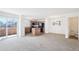 Open concept living room and kitchen space with stainless appliances and ample natural light at 23505 E Platte Dr # 8D, Aurora, CO 80016