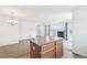Inviting open concept featuring living room with a fireplace adjacent to the kitchen island at 23505 E Platte Dr # 8D, Aurora, CO 80016