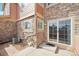 Private brick patio featuring a sliding door, perfect for outdoor relaxation at 23505 E Platte Dr # 8D, Aurora, CO 80016