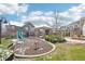 Community playground featuring a covered gazebo, slide, and play horse, set against well-maintained landscaping at 23505 E Platte Dr # 8D, Aurora, CO 80016