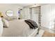 Bedroom with built-in shelving and a walk-in closet at 2 Adams St # 108, Denver, CO 80206