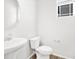 Clean half bathroom with a pedestal sink and modern fixtures at 8850 Sedalia St, Commerce City, CO 80022