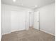 Bedroom featuring neutral walls, carpet, and a closet with sliding doors at 8850 Sedalia St, Commerce City, CO 80022