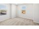 A well-lit bedroom featuring neutral carpet, and a window at 8850 Sedalia St, Commerce City, CO 80022