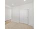 Bright bedroom with neutral carpet and a closet with sliding doors at 8850 Sedalia St, Commerce City, CO 80022