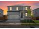 Charming two-story home with a well-manicured lawn, front porch, and two car garage at 8850 Sedalia St, Commerce City, CO 80022