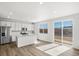 Bright kitchen featuring white cabinets, stainless steel appliances, and a granite island at 8850 Sedalia St, Commerce City, CO 80022