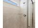 Nicely tiled shower stall, features updated showerhead and glass door at 8850 Sedalia St, Commerce City, CO 80022