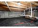 Unfinished basement with exposed beams, utilities, and potential for customization at 2466 S Delaware St # 3, Denver, CO 80223