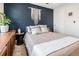 Bright bedroom featuring a plush bed, chic decor, and a calming color scheme at 2466 S Delaware St # 3, Denver, CO 80223