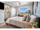 A modern bedroom with an ensuite bathroom and lots of natural light at 2466 S Delaware St # 3, Denver, CO 80223
