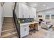 View of the living room and kitchen from the stairs at 2466 S Delaware St # 3, Denver, CO 80223