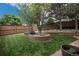 Lush backyard featuring a brick-lined garden bed and manicured lawn at 4501 Whitehall Ln, Highlands Ranch, CO 80126