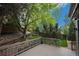 Outdoor deck with wood railings overlooking beautifully landscaped private backyard at 4501 Whitehall Ln, Highlands Ranch, CO 80126