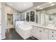 Beautiful bathroom with a large soaking tub, glass shower, and double sink vanity at 4501 Whitehall Ln, Highlands Ranch, CO 80126