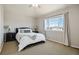 Inviting bedroom with a large window and neutral decor at 4501 Whitehall Ln, Highlands Ranch, CO 80126