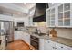 Modern kitchen featuring stainless steel appliances, granite countertops, stylish backsplash and plenty of cabinet space at 4501 Whitehall Ln, Highlands Ranch, CO 80126