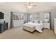 Spacious main bedroom featuring neutral decor and a large picture window at 4501 Whitehall Ln, Highlands Ranch, CO 80126