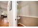 Hallway powder room with a pedestal sink and elegant finishes at 4501 Whitehall Ln, Highlands Ranch, CO 80126