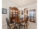 Traditional dining room featuring a large wooden table, china cabinet, and elegant chandelier at 13645 Osage Ct, Broomfield, CO 80023