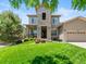 Stunning two-story home with stone accents, a well-maintained lawn, and professional landscaping at 13645 Osage Ct, Broomfield, CO 80023