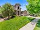 Beautiful two-story home featuring a stone facade and a lush green lawn at 13645 Osage Ct, Broomfield, CO 80023