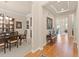 View of the foyer with wood floors that leads to the formal dining room at 13645 Osage Ct, Broomfield, CO 80023